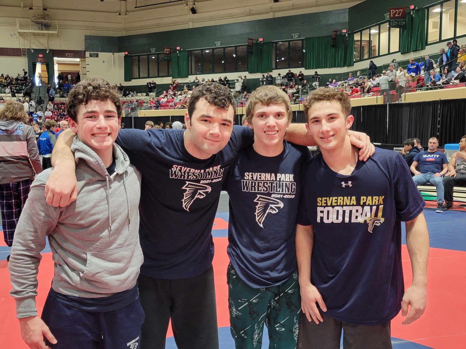 Severna Park’s Patrick Ellis (second from left) won the state wrestling title in March, beating a previously undefeated wrestler in the 220-pound class.