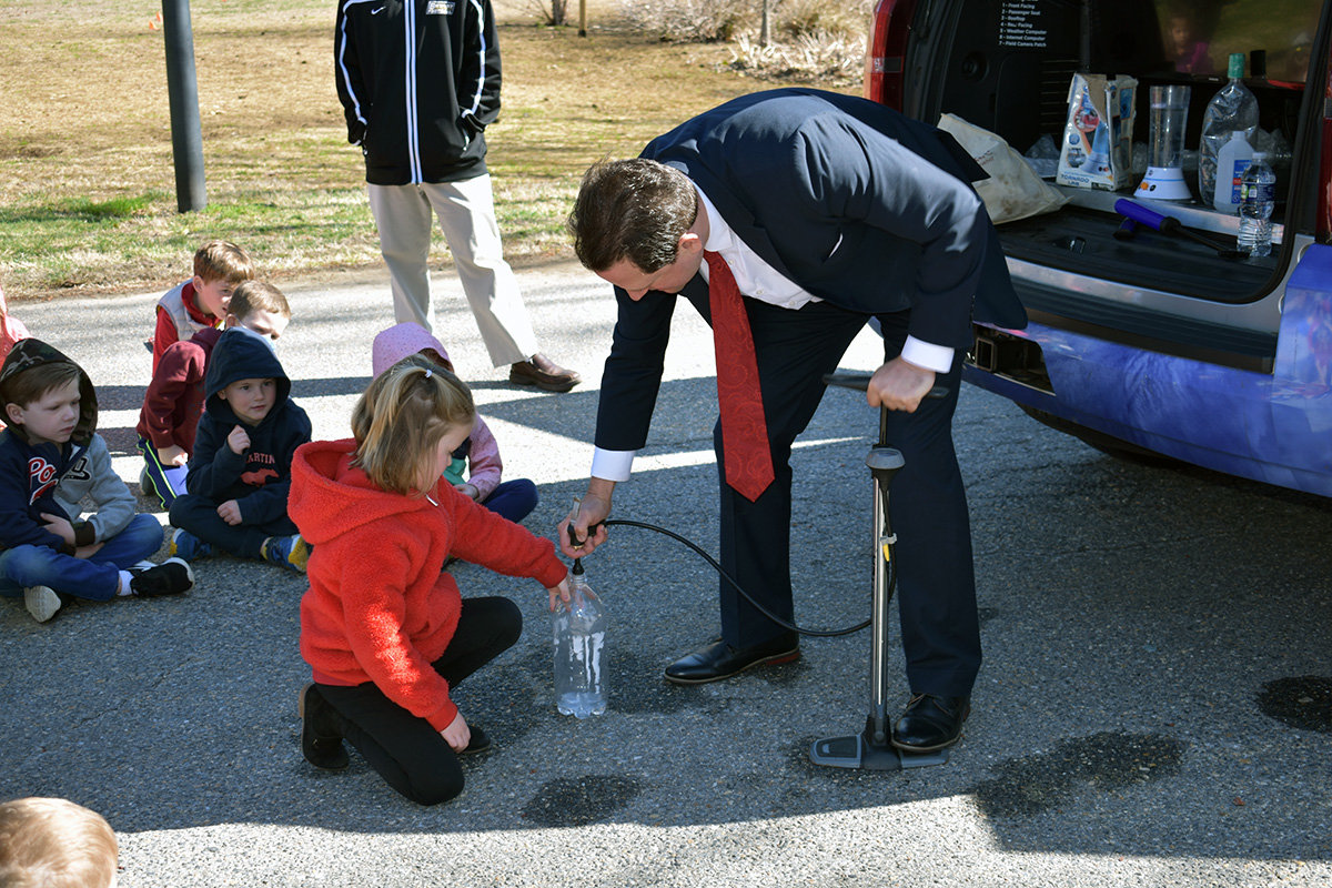 Pre-K student Morgan Camponeschi assisted with a cloud in a bottle experiment.