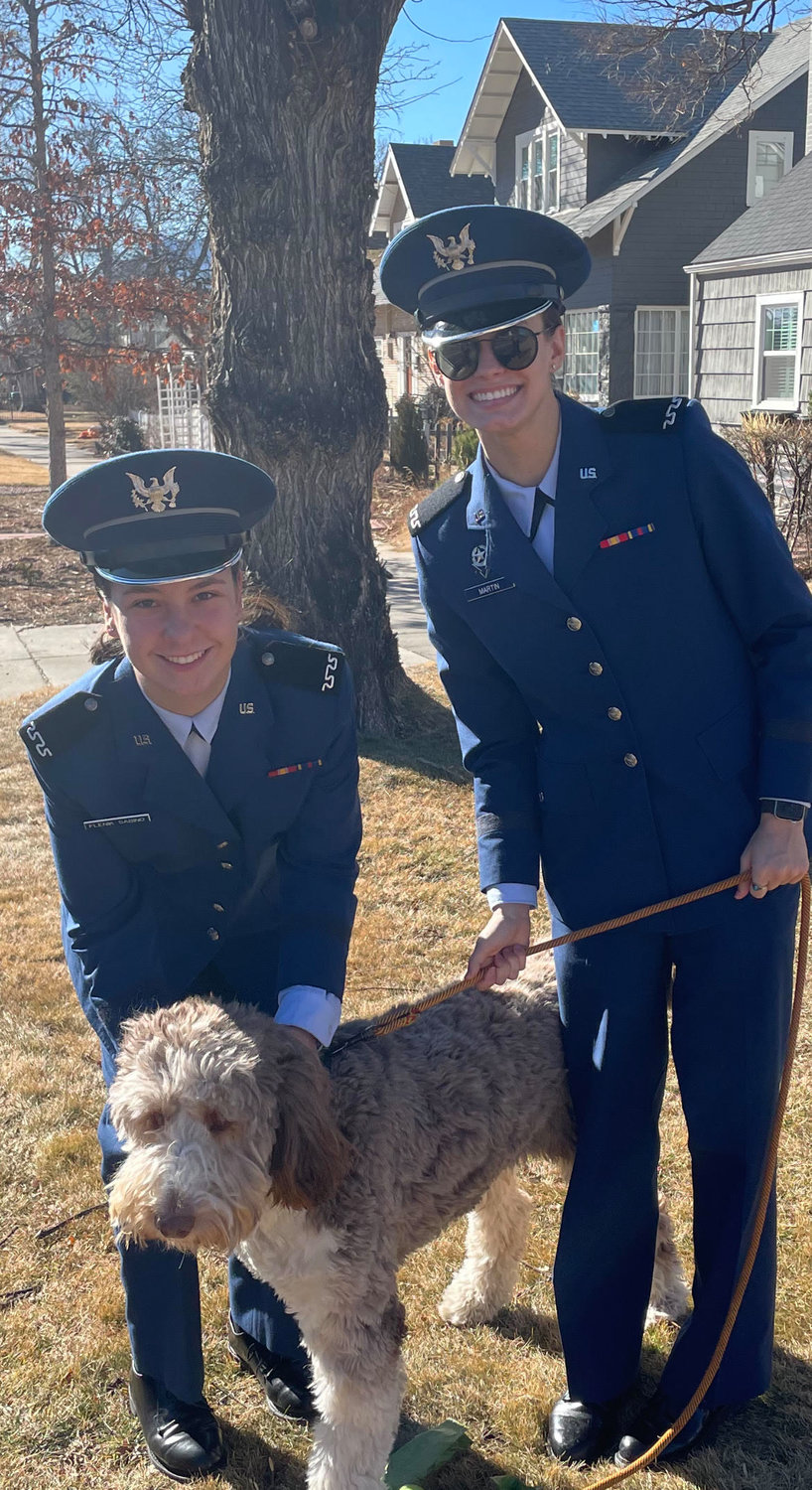 Ella Martin (right) is pictured with her roommate, Cadet 4th Class Flenik Sabino, and Ella's sponsor puppy, Oki.
