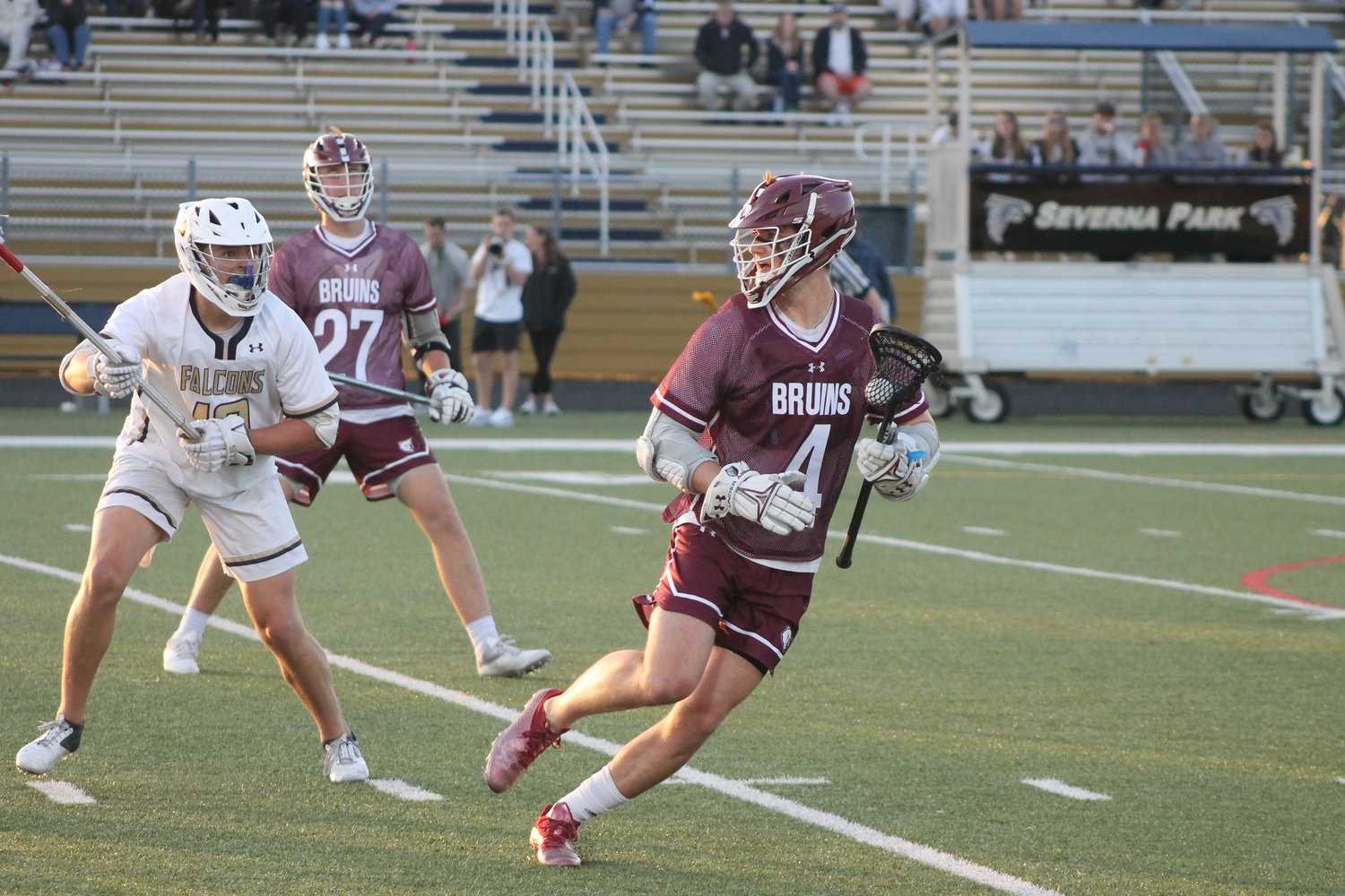 Broadneck’s Ryan Della looked to pass the ball after Falcons defender Brayden Flynn (left) closed off his shooting lane.