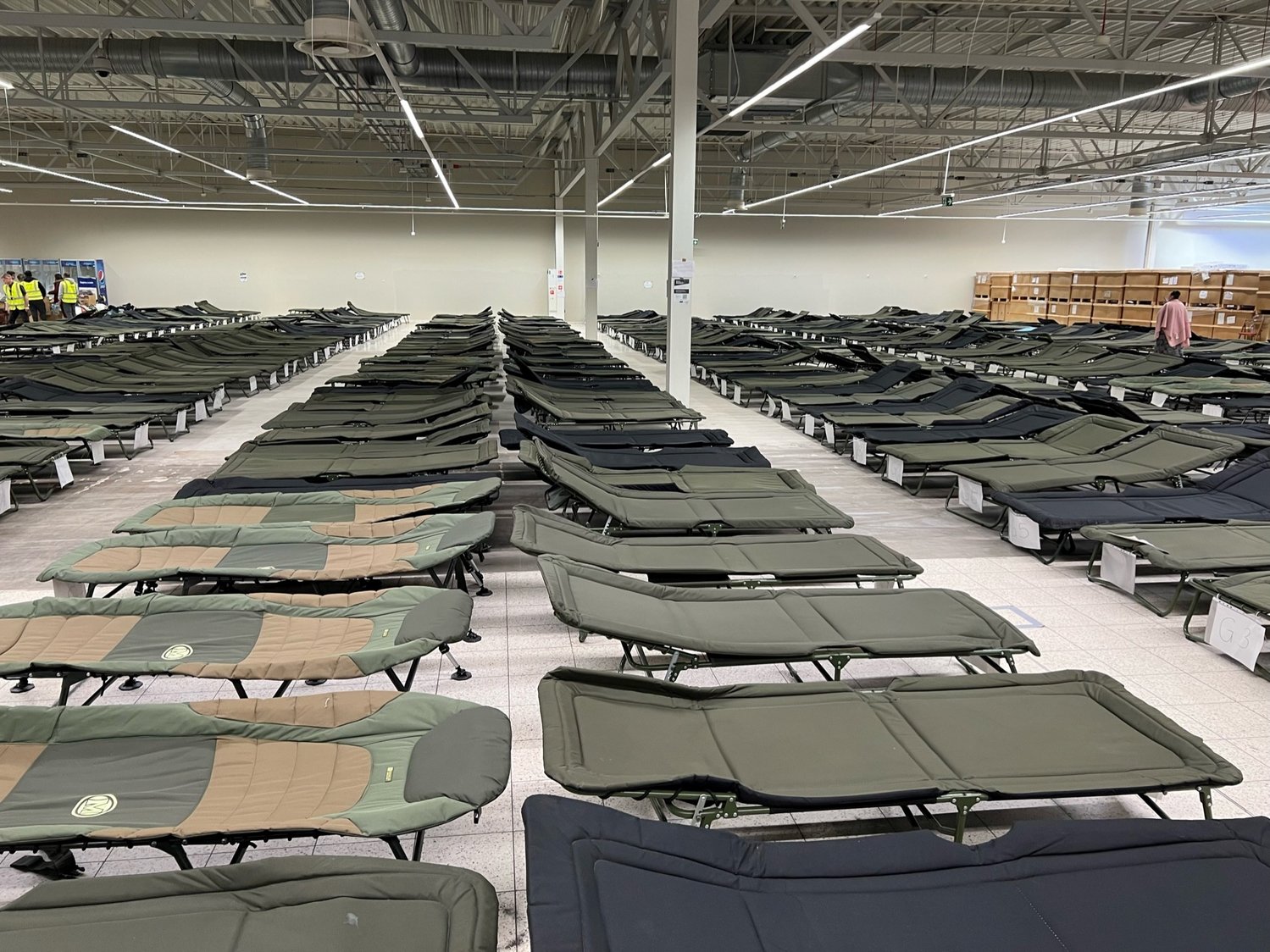 Cots awaited refugees at an absorption center in Przemysl, Poland.