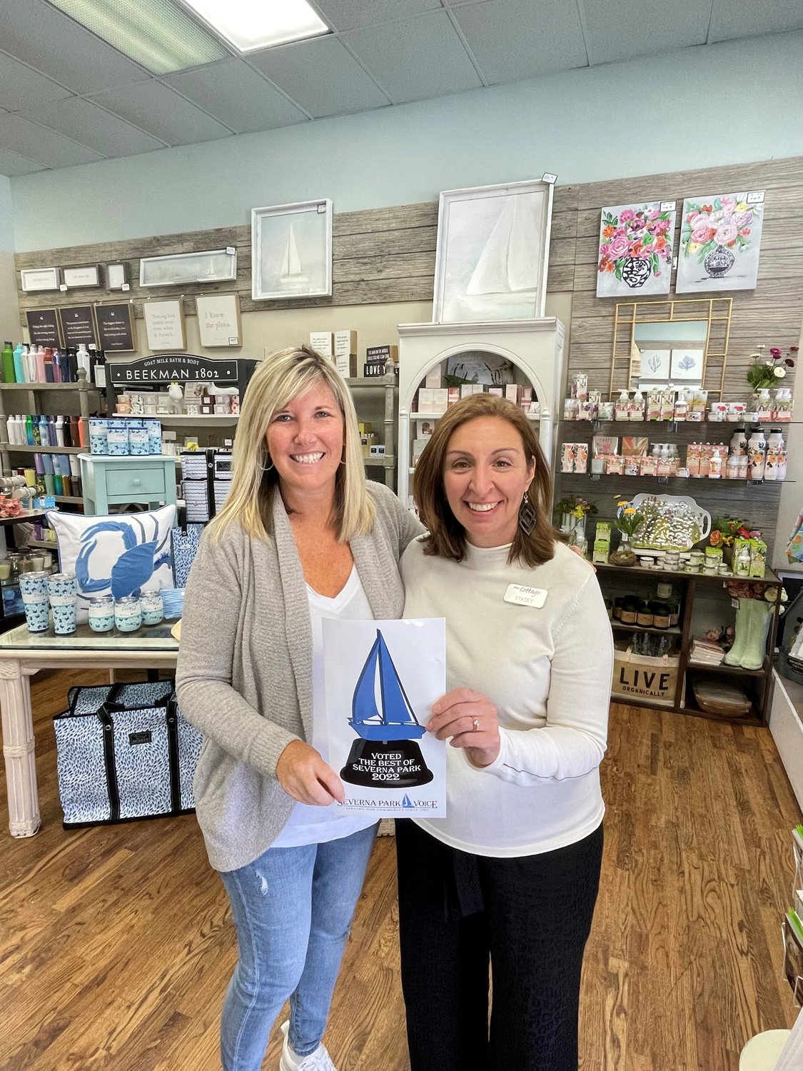 Courtney Caughy (left) and Stacey Rinker accepted The Cottage's awards for Best Gift Shop and Best Home Décor.
