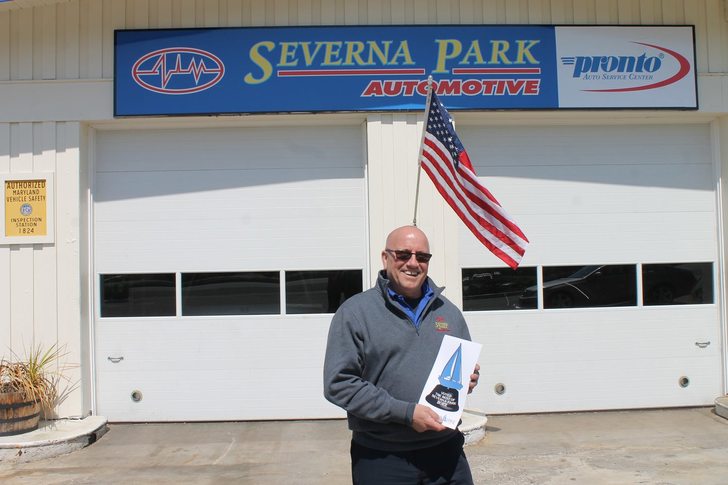 Mike McNealey proudly displayed his Best Auto Repair award outside of his shop, Severna Park Automotive.