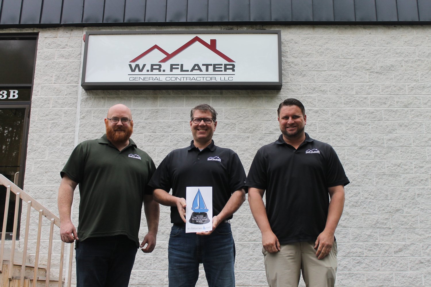Rick Flater (center) received the Best Home Improvement Contractor award. He was flanked by Jason Haschert (left) and John Brill outside of the WR Flater office.