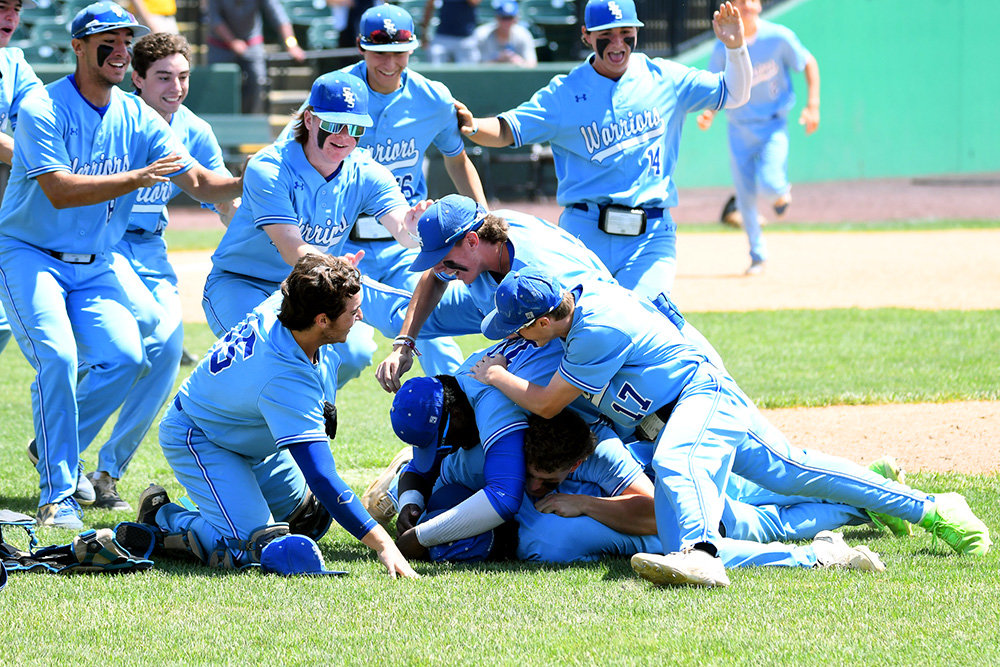 Sherwood players celebrated on the mound after the final pitch.