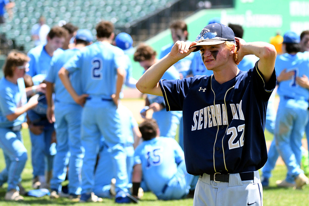 Severna Park outfielder Brooks Harris walked off the field as Sherwood stormed the mound to celebrate their 11-0 win.
