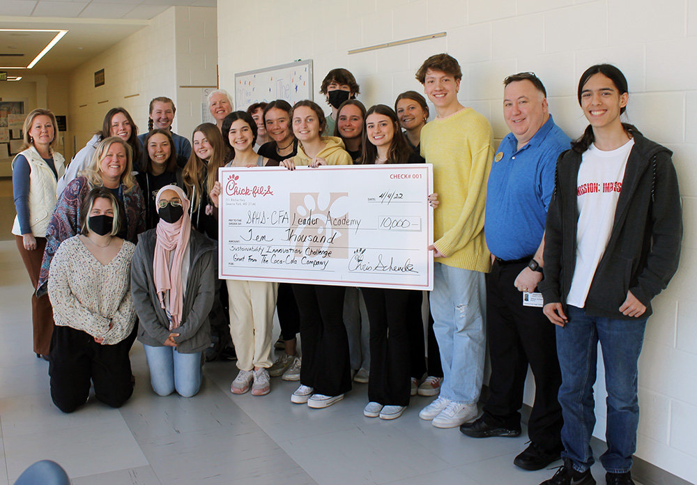 Severna Park Chick-fil-A Leader Academy students were called to a meeting in April and surprised with a $10,000 check from the Coca-Cola Company. Severna Park Chick-fil-A owner Chris Schenck was among the mentors who attended the meeting.