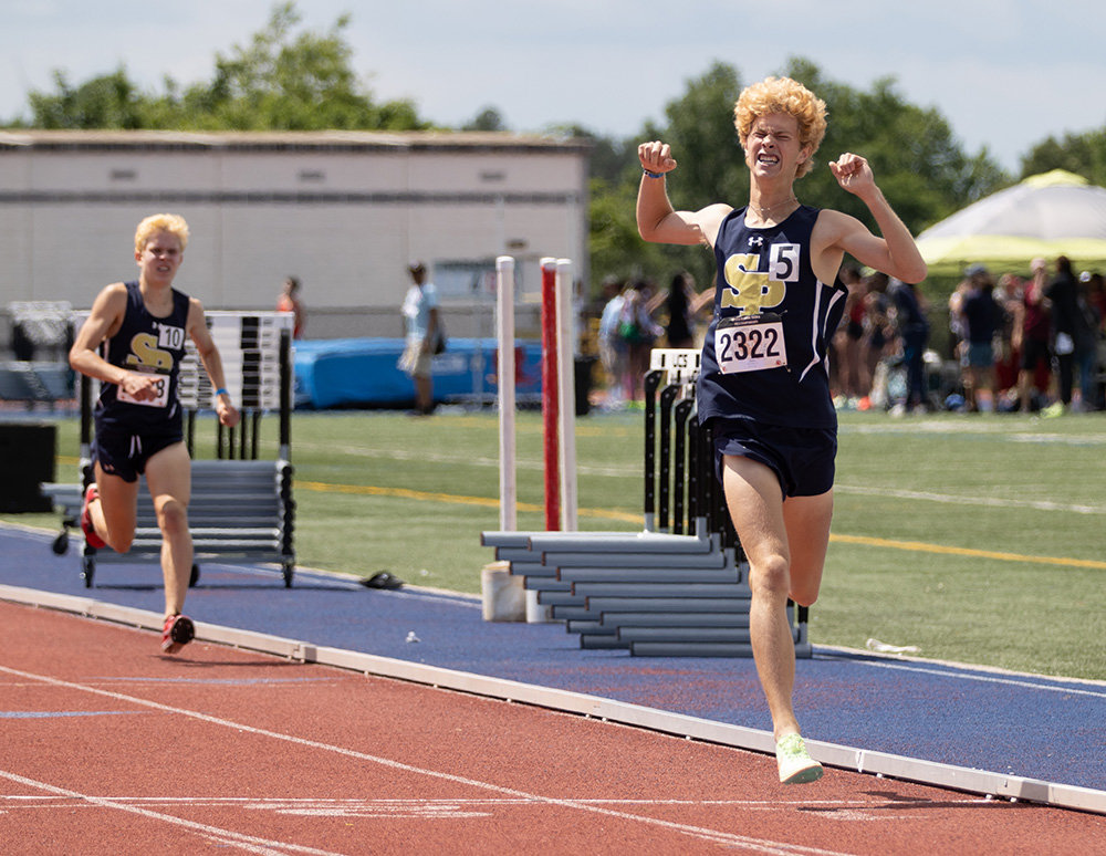 Tyler Canaday showed his excitement after winning the 1600-meter run, just ahead of teammate James Glebocki.