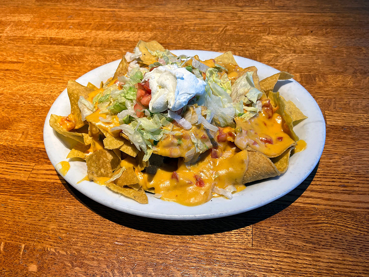 The macho nachos are made with home-cooked tortilla chips and are coated in several toppings. Nacho cheese sauce dripped down nearly every chip, which complimented the fresh diced tomato and lettuce – topped with a dollop of sour cream. There’s no real spice here, but the appetizer is flavorful.