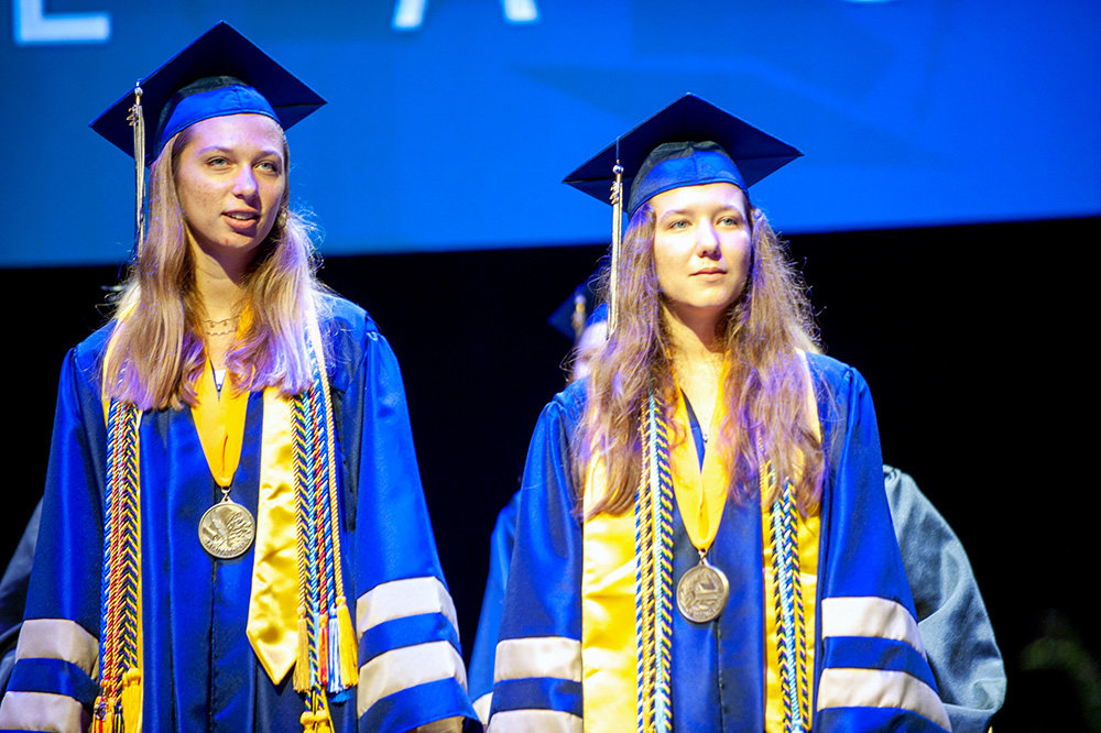 Neela Baker (left) and Nicole Baker were onstage during Severna Park High School’s graduation at Live! Casino & Hotel in Hanover on June 9.
