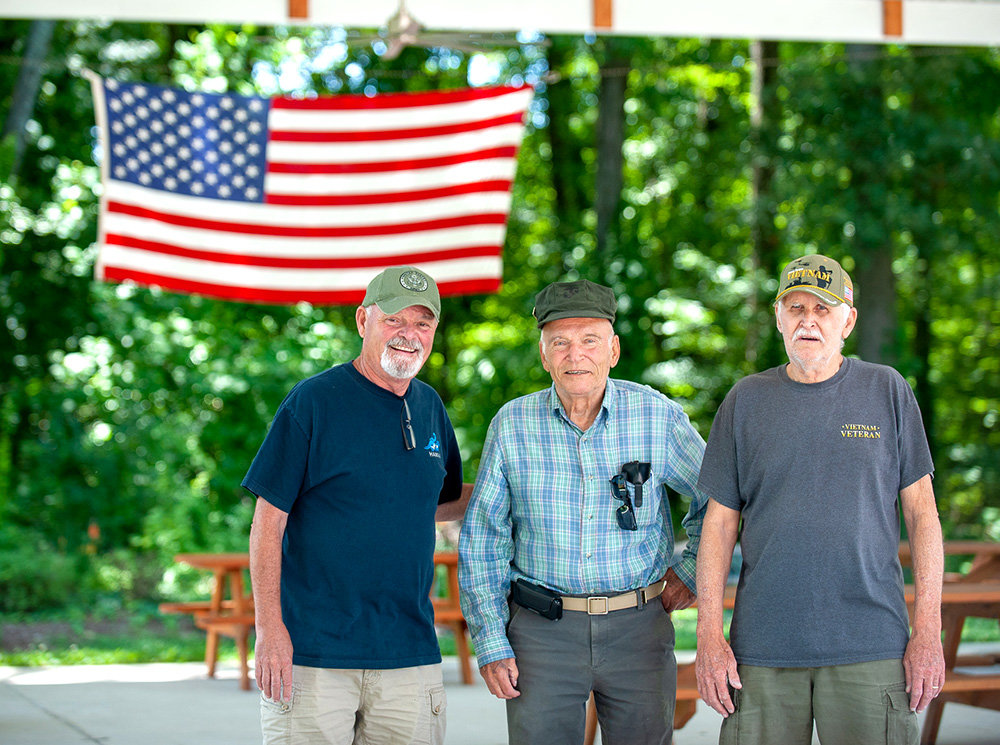 (L-R) American Legion Post 175 commander Ambrose Cavegn and fellow members Joseph Scholle and William Vincent enjoy camaraderie at their site on Manhattan Beach Road.