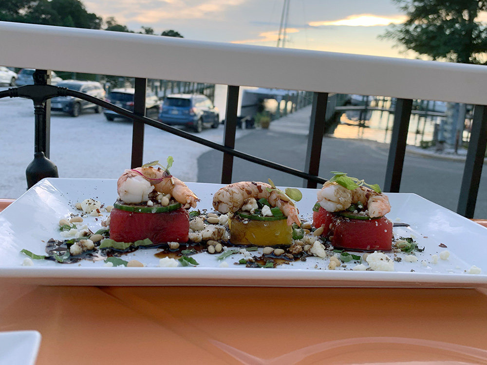 An appetizer of gulf shrimp and compressed watermelon was beautifully presented.