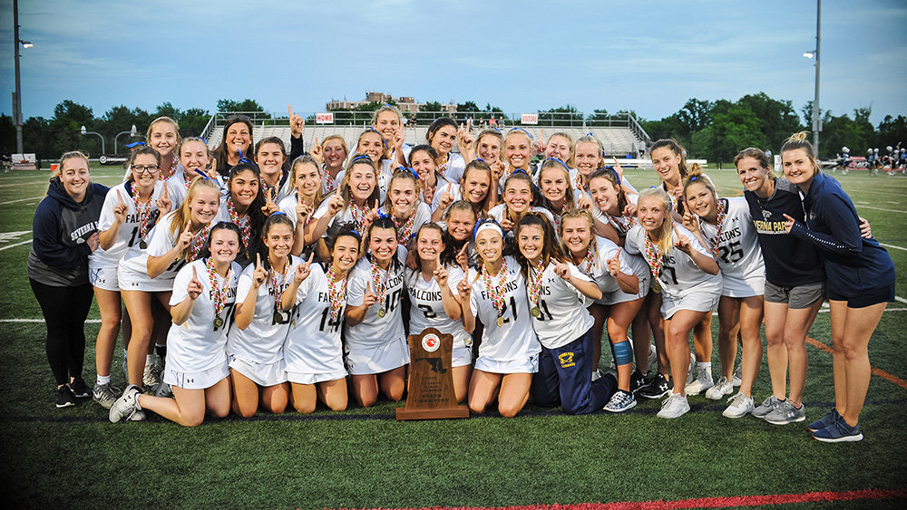 Kaitlyn Hines (second from right) coached the Severna Park girls to a lacrosse championship in 2019.