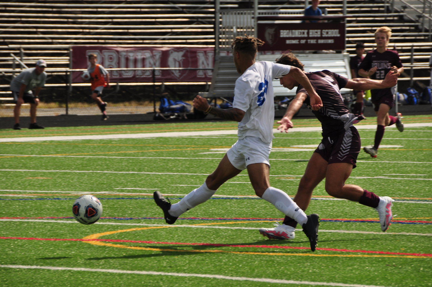 Riley Erbe (right) took a shot at the goal as a Calvert defender attempted a block. Erbe would score on this shot to extend Broadneck’s lead.