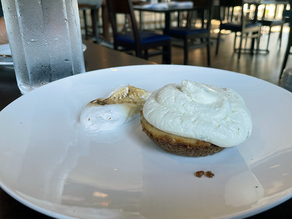 Tangy and sweet, the key lime pie is served with whipped cream and toasted marshmallow cream.