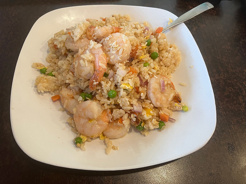 The shrimp fried rice had savory flavor, was speckled with mixed vegetables, and was topped with large, succulent shrimp.