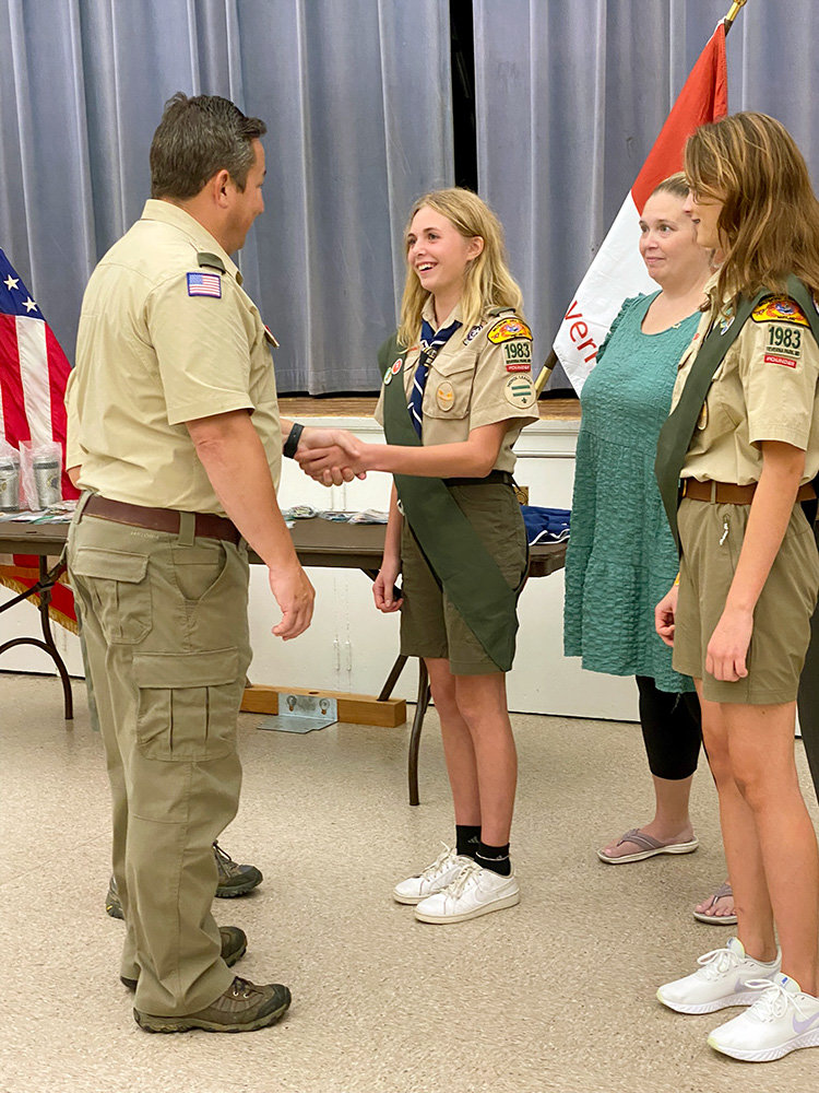 Troop 1983 Scoutmaster Jason Port congratulated the two Scouts who earned first-class rank, achieving a huge milestone in their scouting career.