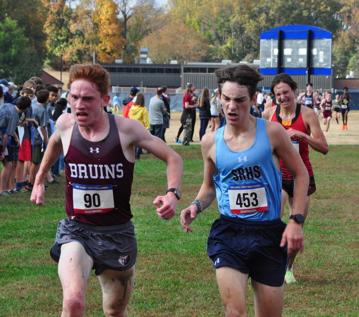 Broadneck High School senior Ben Sterner (left) bested South River High School senior Cole Ford by a tenth of a second at the county cross country championships at South River High School in Edgewater on October 26. Sterner and Ford finished in 26th and 27th place, respectively.