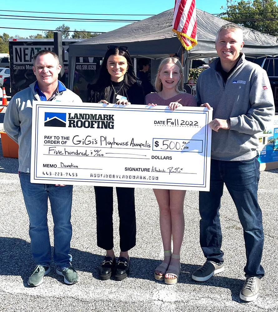 (L-R) Landmark Roofing President of Sales Rob Calhan, GiGi's Playhouse Executive Director Allyson Mccain, Everly Hendricks, and Landmark Roofing President of Operations Artie Hendricks gathered in October to celebrate a $500 donation to GiGi’s Playhouse.