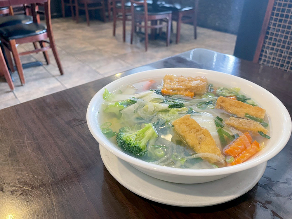The bowl of pho had tender carrots, broccoli and rice noodles. A side dish of vegetables included bean sprouts, jalapeños for a spicy pop, basil leaves, and lime wedges for zest.