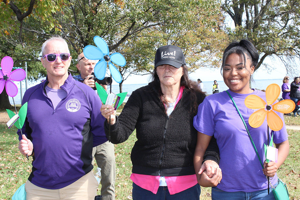 Cidnei Crumity (right), from Brightview Severna Park, held an orange Promise Garden flower during the 2022 Walk to End Alzheimer’s at Sandy Point State Park in Annapolis on October 16. Orange flowers are for those who support the cause and the Alzheimer’s Association's vision of a world without Alzheimer's and all other dementia. Blue flowers represent someone living with Alzheimer’s or other forms of dementia and the purple flowers represent somebody who has lost someone to the disease.