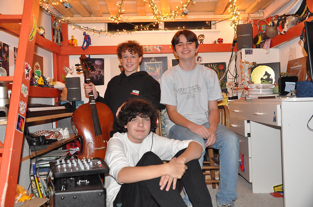 Following a private performance for the Severna Park Voice on October 11, Ivy League gathered in Keith Ivey’s bedroom where the band mixed their debut album, titled “Homecoming.” Ivy League is composed of drummer Cam Blackburn (top left), keyboardist and bassist Ivey (top right), and lead singer and guitarist Nick Stohler (front).