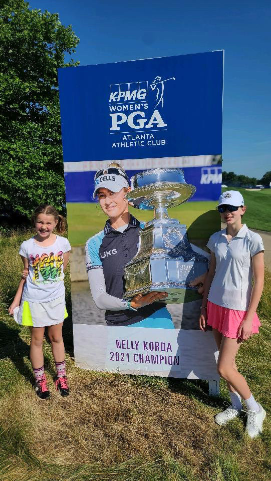 Nicol Chovanec and her sister, Leah, admire professional golfer Nelly Korda.