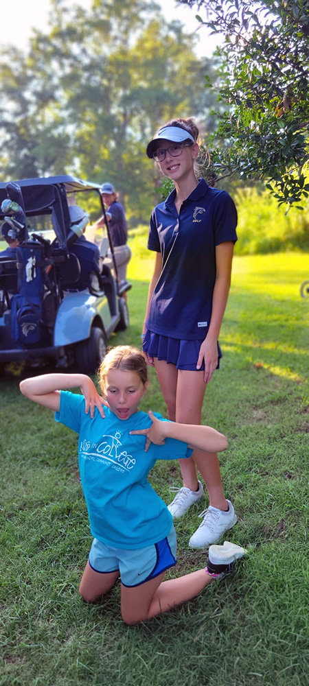 Nicol and Leah Chovanec enjoy their golf practices together.