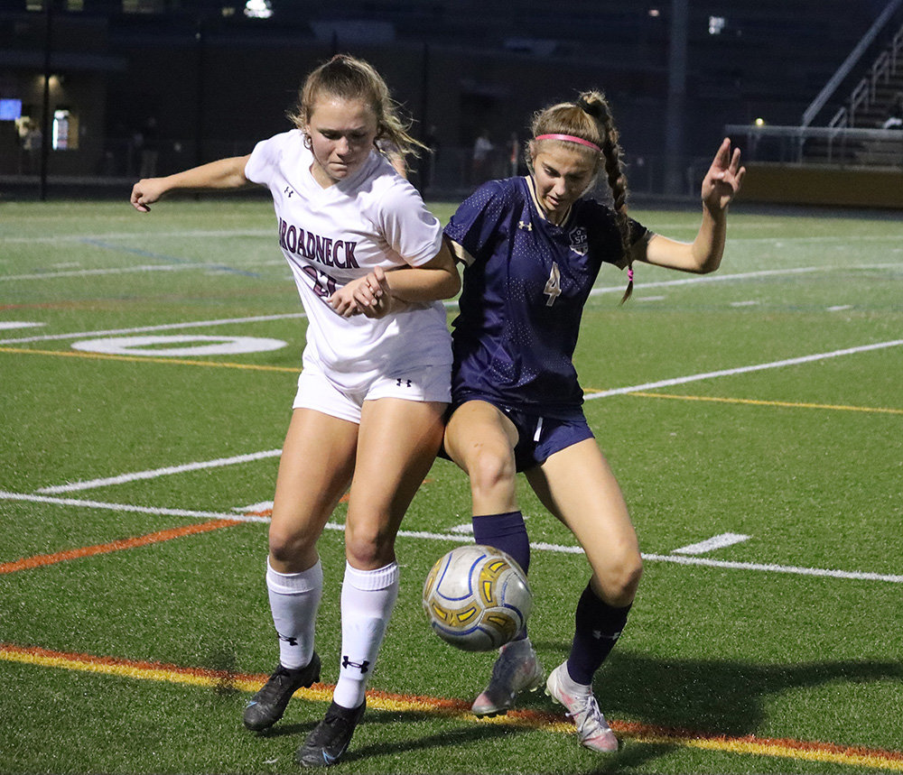 Maddie Capps (left) and Abby Cover fought for possession.