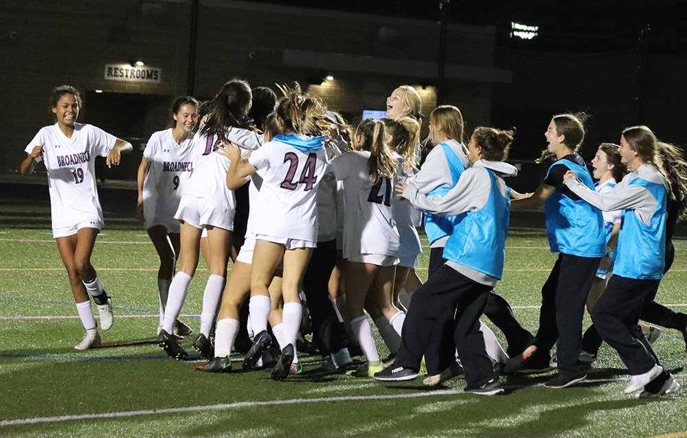 The Broadneck girls soccer team celebrated after defeating Severna Park 1-0 to win the region championship on November 1.