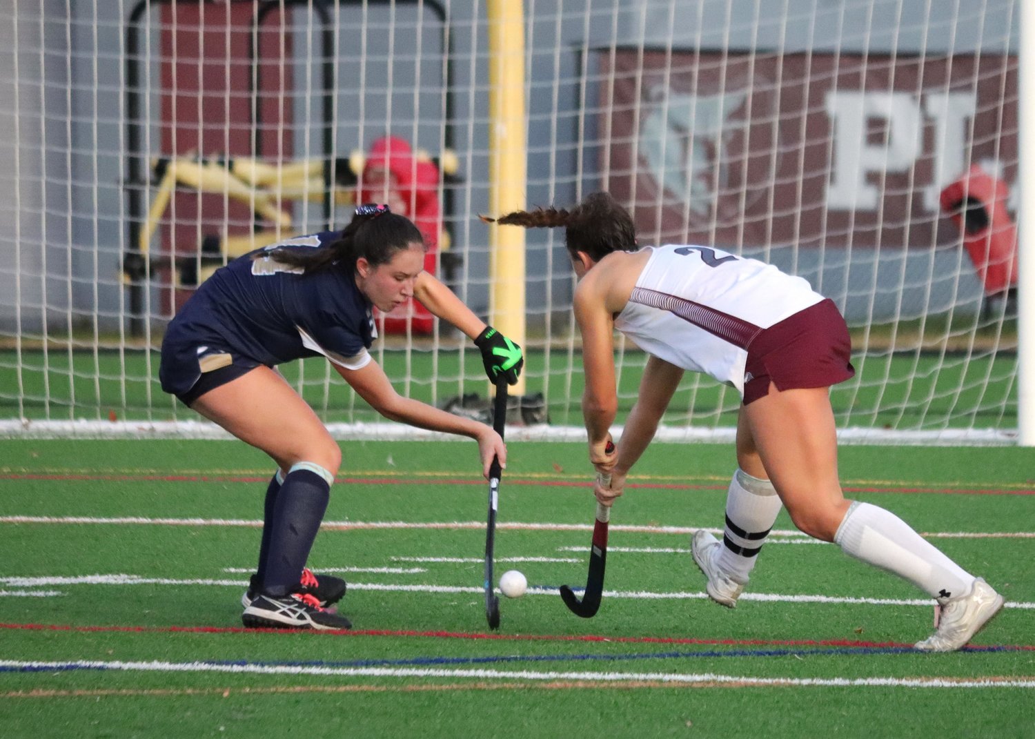 Emma Weber (left) and Maya Everett fought for control of the ball.