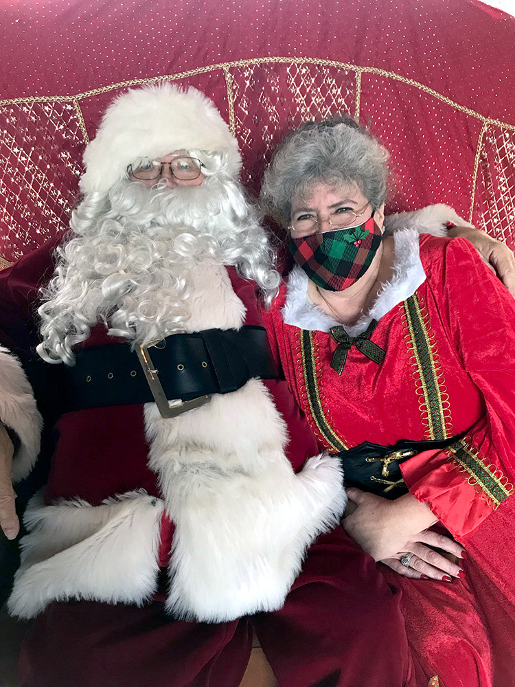 Santa and Mrs. Clause attended the Elves for Elders stocking-stuffing party in 2021.