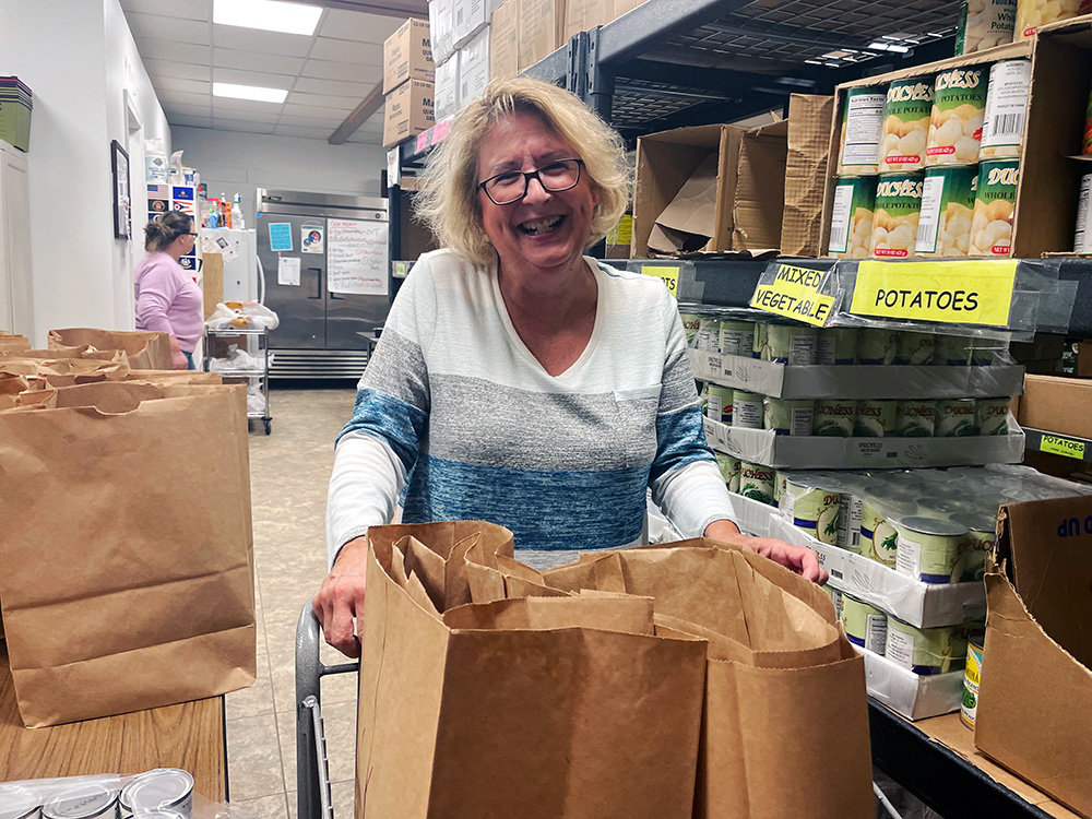 A volunteer from Community United Methodist Church in Pasadena, one of Anne Arundel County Food Bank’s more than 70 member agencies, packed food bags to distribute to people facing food insecurity.