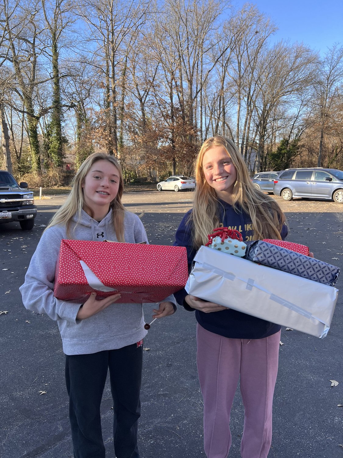 A pair of residents provided gifts for the needy during Serving People Across Neighborhoods’ Christmas Holiday Caring program last year.