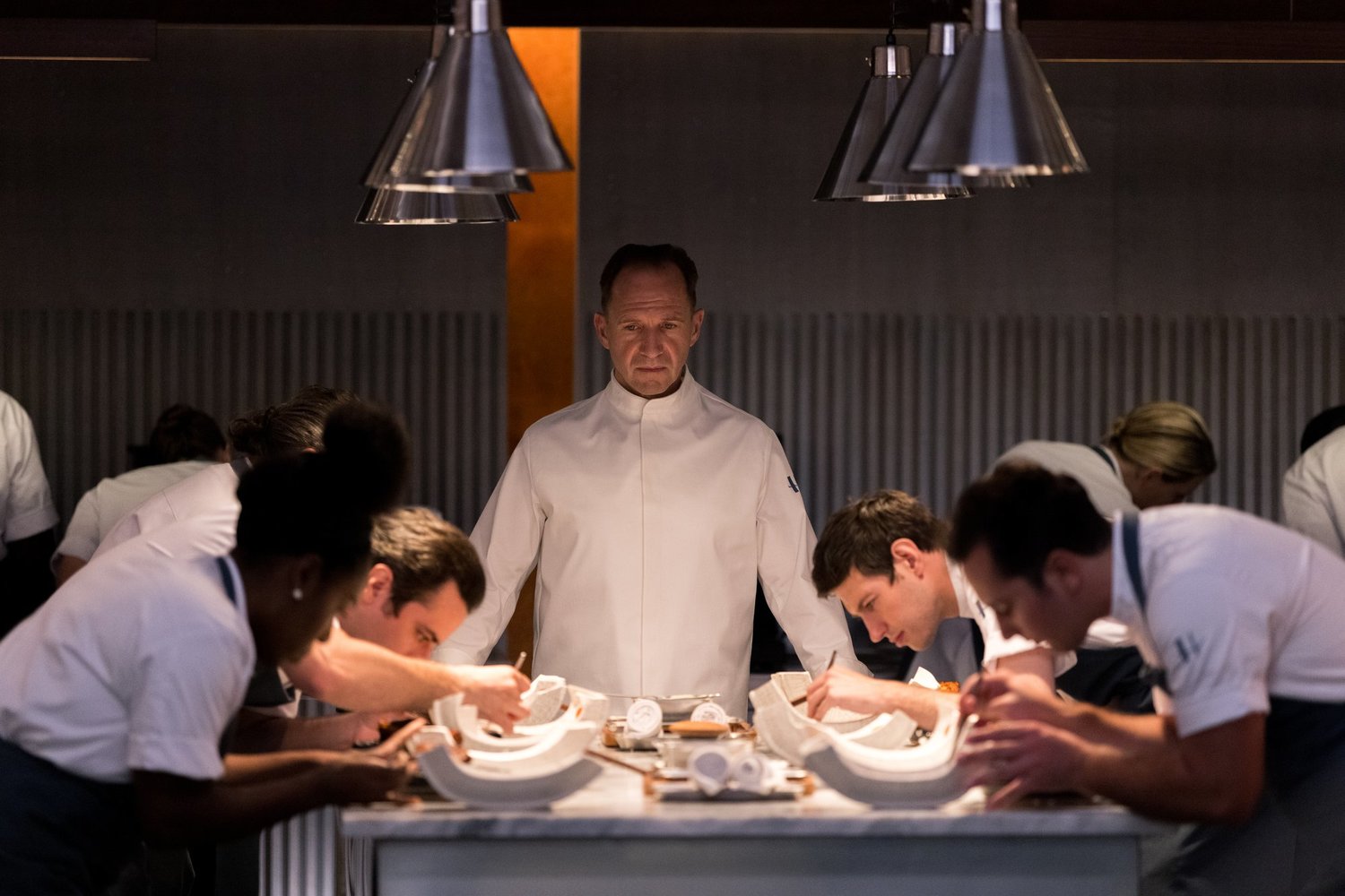 Ralph Fiennes stars in “The Menu,” a witty, biting black comedy.