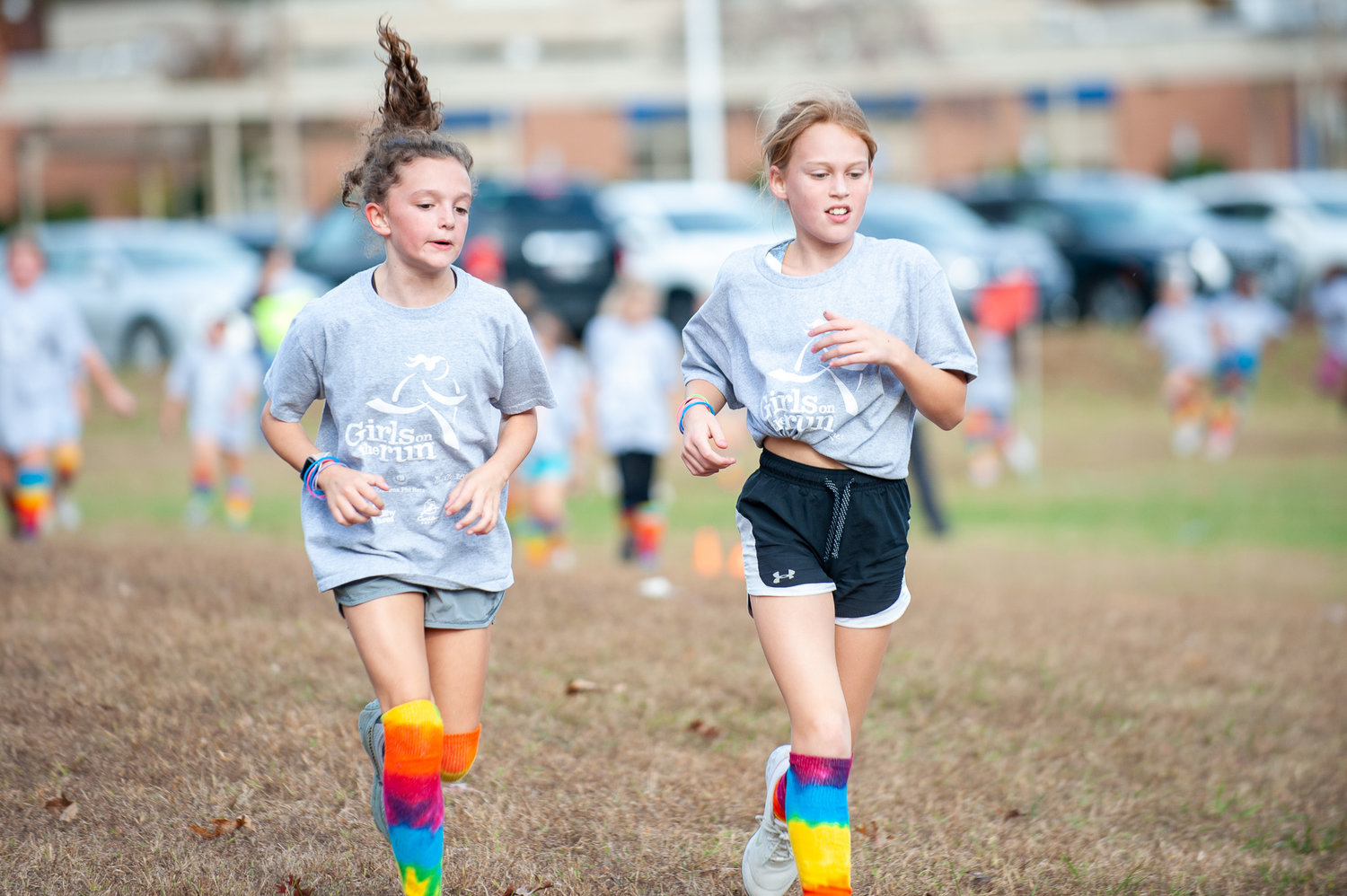 Morgan Hamilton (left) and Claire Crivella kept a fast pace while running at Oak Hill Elementary.