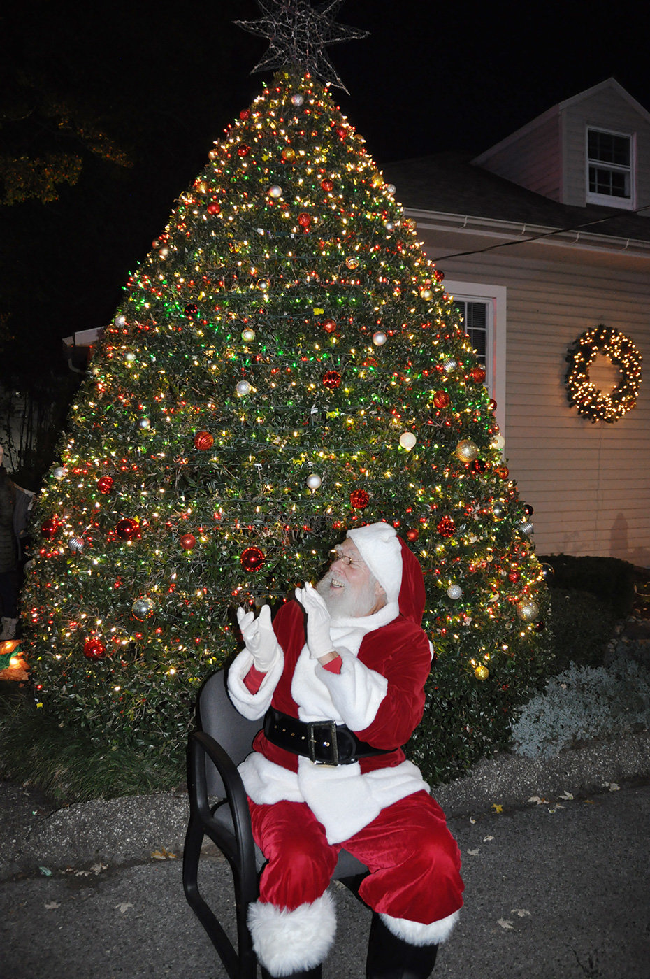 Dressed as Santa, Freeman Bagnall applauded when the holly tree was lit.