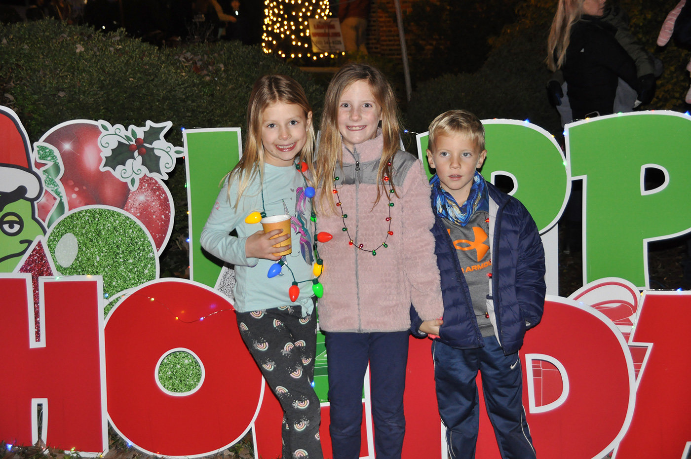 Willa Higgs, Charlotte Wallace and Cooper Wallace enjoyed the tree-lighting festivities.