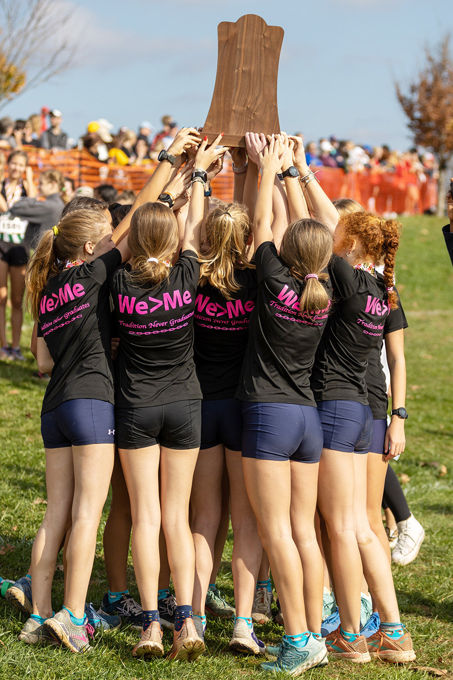 After winning the state championship, the Severna Park girls hoisted the trophy while wearing shirts saying, “We > Me.”