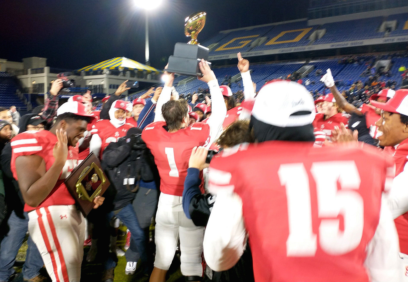 Archbishop Spalding's senior linebacker PJ Poknis raised the MIAA championship trophy on November 18 after the Cavaliers beat Calvert Hall 34-10 in a game played at the Navy-Marine Corps Memorial Stadium in Annapolis.