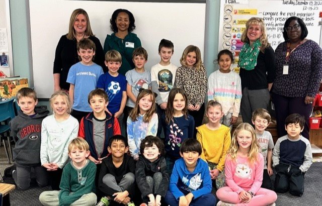 (L-R) Oak Hill teacher Pat Anderson, Services from the Heart founder and president Donna Wilson-Johnston, Oak Hill Principal Deneen Houghton and financial secretary Bernadette Jackson celebrated the successful fundraiser with second-graders.
