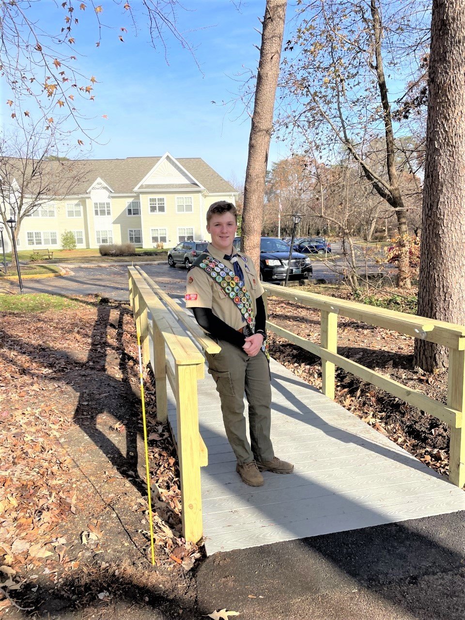 Adam Jackson chose the bridge for his Eagle Scout project because his family attends services at Woods Church, and he has had grandparents live in Sunrise’s independent and assisted living units.