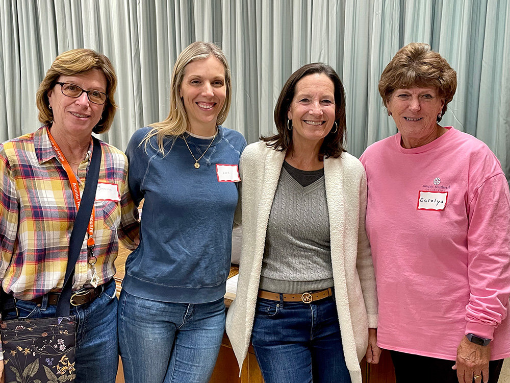 Severna Park United Methodist evening hosts Joanne Ritter, Kara Booth and Holly Foster paused for a moment with coordinator Carolyn Heim.