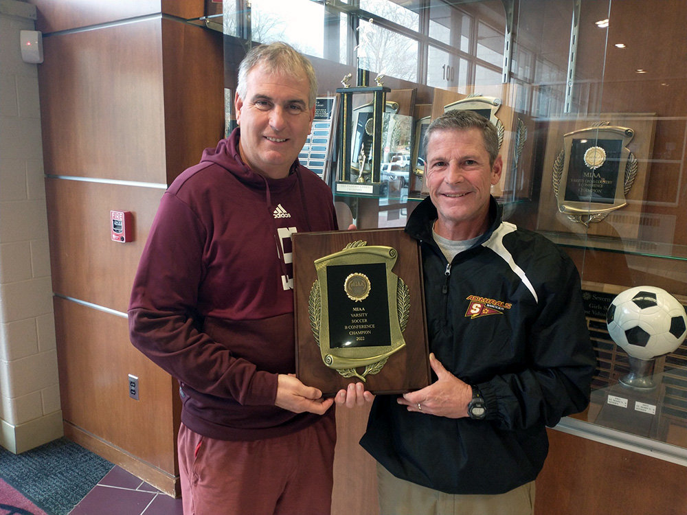 Severn School's Athletic Director Julian Domenech (left) displayed the MIAA B Conference trophy with head soccer coach Mike McCarthy. The Admirals went 17-0 and scored 87 goals this year.