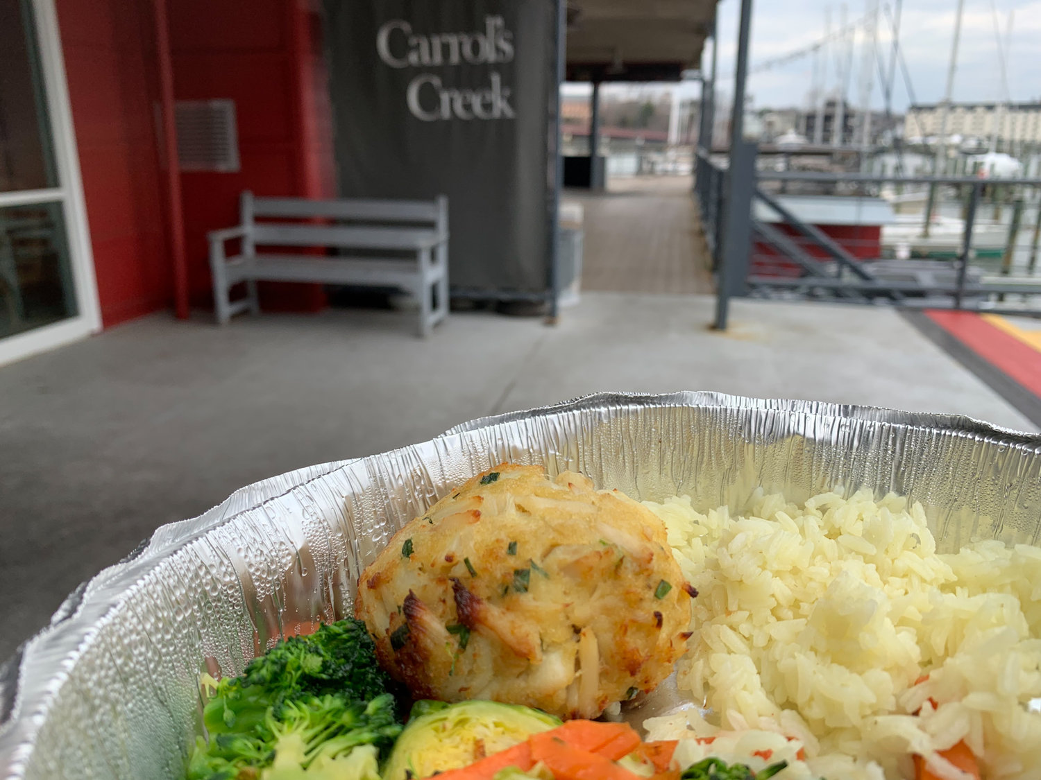 The crab cake at Carrol’s Creek Cafe is minimally processed, with hardly any filler, if at all, with tiny scallions and an almost creamy, slightly sweet taste.