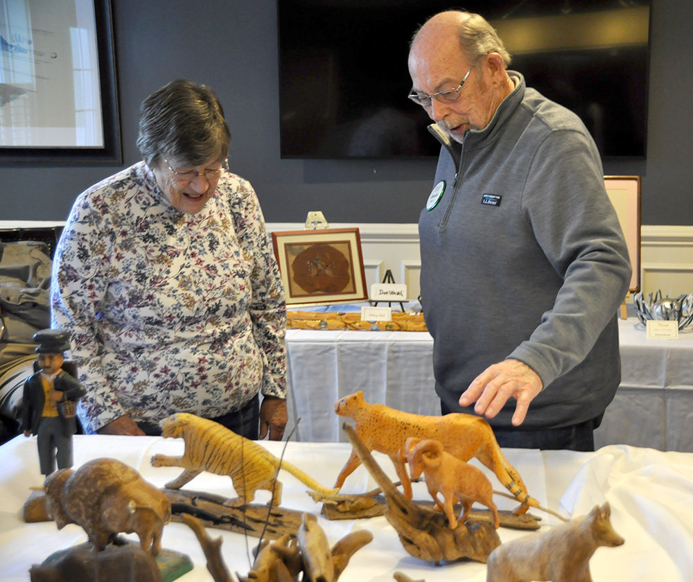 Don Weak, a Brightview Severna Park resident, spoke about his wood carvings to a guest at a Brightview resident art show last month.