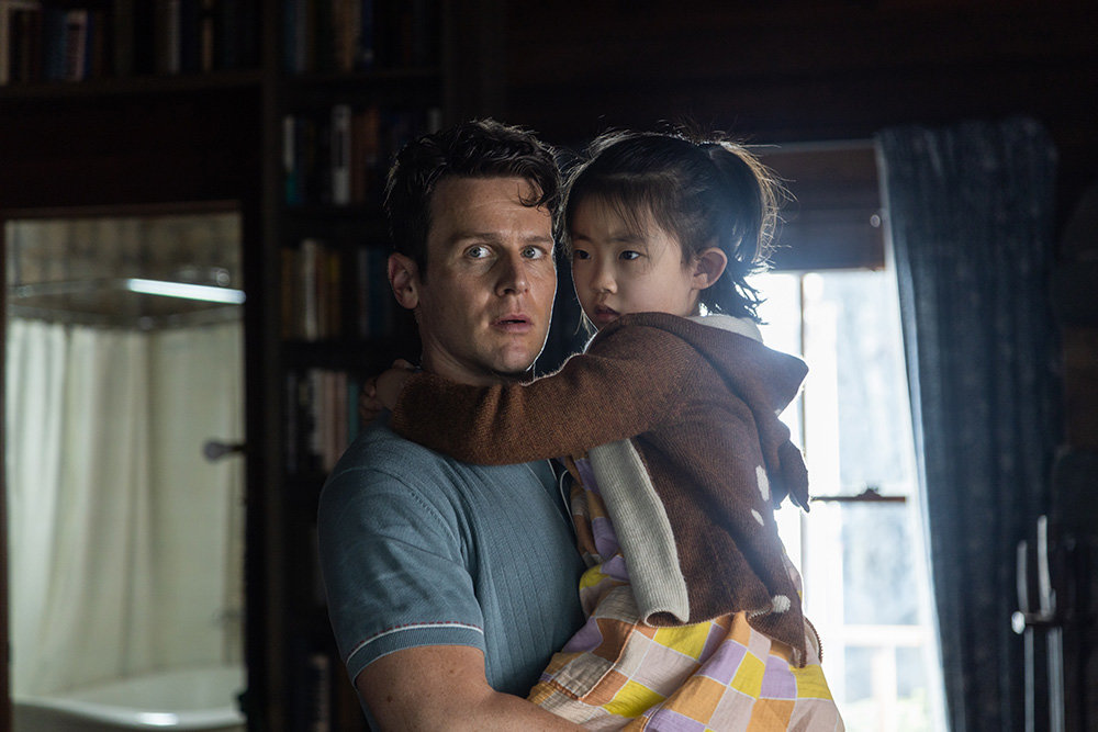 Eric, played by Jonathan Groff, must decide which of his family members to sacrifice. His daughter Wen is played by Kristen Cui.