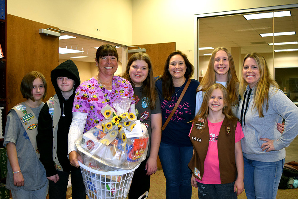 Girl Scout Troop 1448 added helping hands during the last Sunflowers for Sallie food drive.