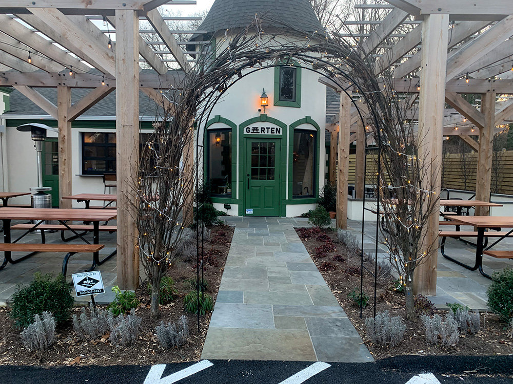 Customers can enter the back of the restaurant through a vine-covered arch for indoor dining or to a patio with twinkle lights.