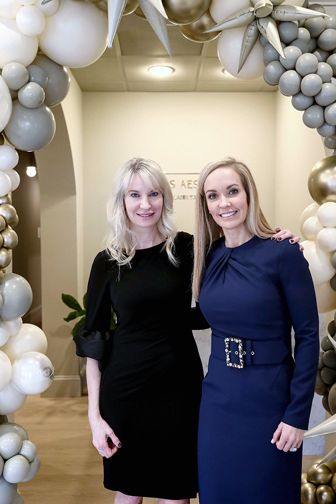 Melanie Erb Shushan (right) and Annapolis Aesthetics office manager Christine Krebs celebrated their official ribbon cutting.